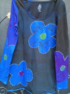 This Angel handpainted blue-flower shirt would look great under the black Desigual Medianoche jacket. I recently painted this shirt and it's still available at Angel Vancouver (angelvancouver.com). The price is $69. angel.blue.flower.top